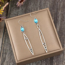Alloy rhinestone asymmetric earrings with silver arrow design and turquoise gems