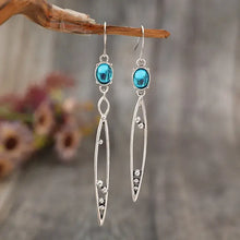 Alloy rhinestone asymmetric earrings with turquoise oval gemstones