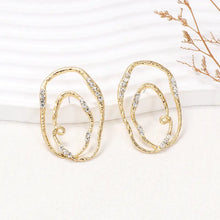 Gold-toned rhinestone geometric earrings with irregular drop shape