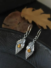 Alloy rhinestone leaf shape earrings with silver dangles and amber gems