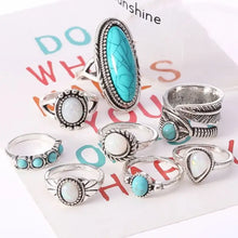 Alloy turquoise and opal ring set in silver-toned designs with gems