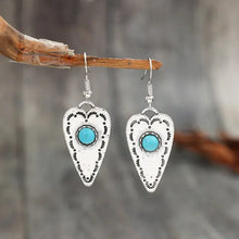 Alloy turquoise heart dangle earrings with silver-tone drops and central stones