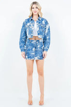 Blue denim jacket with distressed camouflage pattern paired with american bazi jacquard trim cargo mini denim skirt