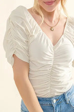 Off-white buttery soft ruched detailed jersey bodysuit with short sleeves and square neckline for stylish wear