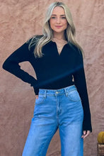 Black ribbed johnny collar long sleeve bodysuit with v-neck and cut-out side panels by And The Why