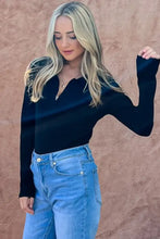 Black ribbed bodysuit with v-neckline and johnny collar long sleeve design from and the why collection