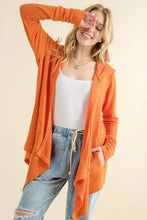 Thermal hooded open front orange cardigan with long sleeves and pockets