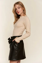 Beige long sleeve bodysuit with ribbed cuffs and high round neck featuring half button round neck design