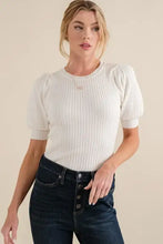 Cream-colored ribbed knit bodysuit with puffed half sleeve rib design in a puffed half sleeve style