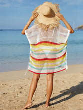 Woman in angel wings cutout wings striped cover-up with moderate stretch