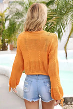 Orange cable-knit cropped round neck top with angel wings drawstring hem