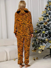 Orange and black tiger-striped plush fabric animal print zip front lounge jumpsuit with long sleeve length and pockets