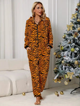 Orange and black tiger striped animal print zip front lounge jumpsuit with hood, long sleeve length, and front pockets
