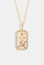 Gold Aquarius rhinestone constellation pendant necklace with enamel accents