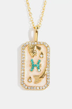 Gold rhinestone constellation pendant necklace with pink dog tag and turquoise H charm