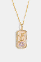 Gold Aquarius rhinestone constellation pendant necklace with purple gemstones