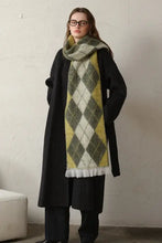 Black long coat with green yellow white argyle polyester scarf