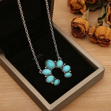 Silver-tone turquoise alloy pendant necklace with stone cluster