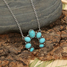 Silver-toned turquoise alloy pendant necklace with horseshoe design