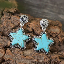 Silver-toned star dangle earrings with artificial turquoise stones