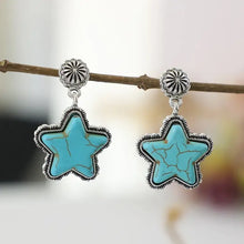 Silver-toned dangle earrings with artificial turquoise star stones