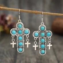 Silver-toned artificial turquoise cross earrings with dangling charms