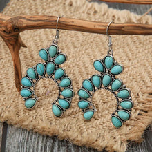 Silver-toned artificial turquoise drop earrings in horseshoe design