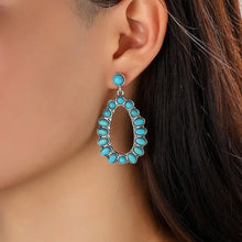 Silver-toned teardrop artificial turquoise earrings