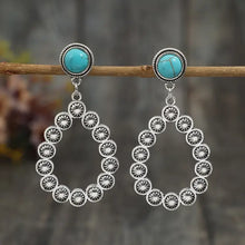 Silver-toned artificial turquoise teardrop earrings with concho details