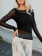 Black lace long sleeve top with sheer floral lace asymmetric panels and solid black bodice detailing
