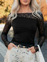 Black lace long sleeve top with sheer floral lace asymmetric panels and solid fabric bodice for elegant wear
