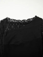 Black asymmetric panels long sleeve top featuring sheer floral lace trim along the neckline and delicate patchwork