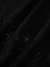 Black lace fabric with intricate sheer floral lace patterns and soft flowing texture for long sleeve top panels