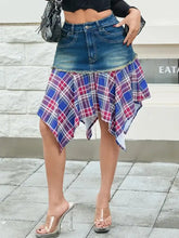 Asymmetric denim skirt with a blue red and white plaid hem ruffle overlay featuring an asymmetric plaid hem design