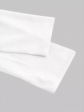 White cotton pillowcases with smooth soft texture and crisp finish complement asymmetrical button long sleeve shirt