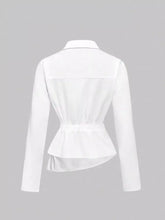 White long-sleeved asymmetrical button blouse with peplum hem and cinched waist for elegant wear