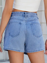 Light wash asymmetrical denim skort with back pockets