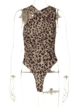 A fitted one-piece leopard bodysuit with asymmetrical crisscross neckline and ruched waist in bold print