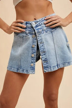 Asymmetrical stretch denim wrap mini skort with button closure