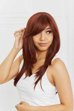 Auburn layered wave synthetic wig with bangs, cap included, on woman in white tank top