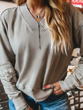 Aztec embroidered western v neck sweatshirt in soft muted gray with ribbed cuffs and front decorative zipper machine wash cold