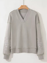 Gray aztec embroidered western v neck sweatshirt with subtle tribal sleeve patterns machine wash cold recommended