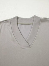 Aztec embroidered western v neck sweatshirt in soft gray with ribbed trim and subtle textured knit machine wash cold