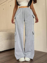 Gray heathered casual drawstring loose fit pants with multiple cargo pockets and an elastic waistband for comfort