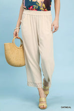 Oatmeal-colored Umgee linen wide leg cropped pants with soft elastic waistband and delicate lace trim at the hem
