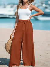 Full size rust-colored wide leg pants with a comfortable drawstring waist designed for plus size wear