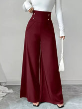 High waist wide leg burgundy satin trousers with three gold-toned buttons at the waistband