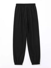 Black elastic-waist butterfly casual sweatpants with relaxed fit and tapered cuffs for comfortable casual wear
