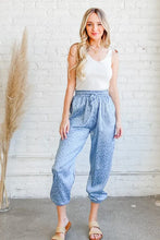 Light blue leopard print satin joggers with elastic waistband and cuffed hems machine wash cold recommended