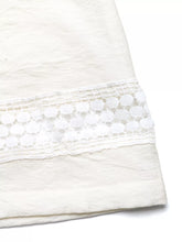 Wide leg pants with pockets featuring a delicate white lace trim with circular cutouts for a perfect fit